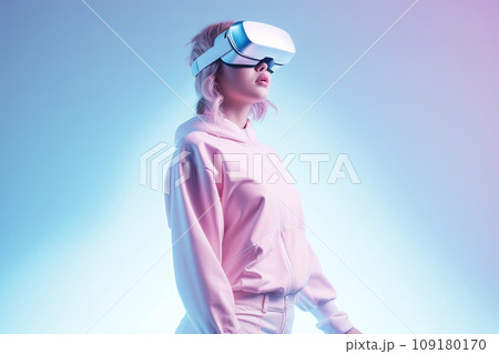 Young woman wearing virtual reality glasses on futuristic minimal neon background. Augmented reality Young woman wearing virtual reality glasses on futuristic minimal neon background. Augmented reality 109180170