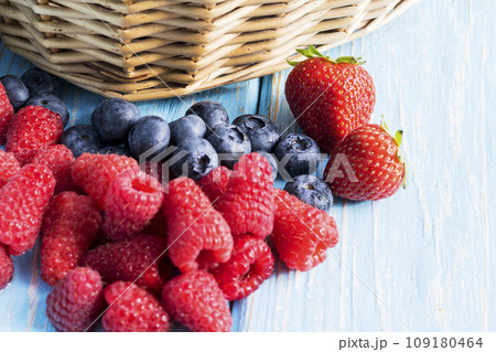 Fresh organic blueberries and raspberries. Blueberry and raspberry.Healthy eating,diet concept Fresh organic blueberries and raspberries. Blueberry and raspberry.Healthy eating,diet concept 109180464