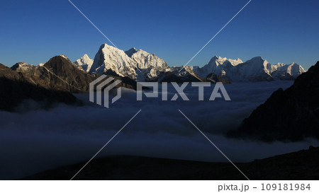 Sea of fog in the Gokyo Valley and sun lit high mountains, Nepal. 109181984