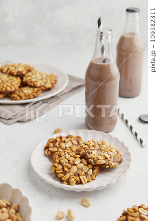 A heap of Portugues traditional peanut cookies known as Bolachas de Amendoim on the white plate 109182311