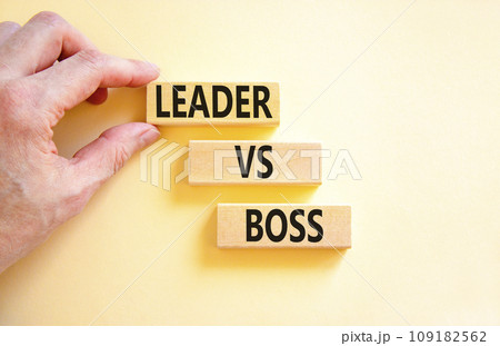 Boss vs leader symbol. Concept words Boss vs versus leader on wooden block. Beautiful white table white background. Businessman hand. Business motivational boss vs leader concept. Copy space. Boss vs leader symbol. Concept words Boss vs versus leader on wooden block. Beautiful white table white background. Businessman hand. Business motivational boss vs leader concept. Copy space. 109182562