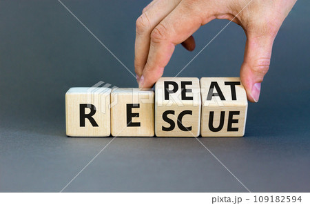 Rescue and repeat symbol. Concept words Rescue Repeat on wooden block. Beautiful grey table grey background. Businessman hand. Business rescue and repeat concept. Copy space. 109182594