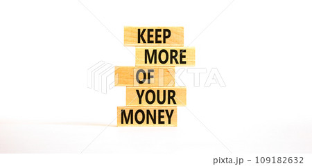 Keep more of your money symbol. Concept words Keep more of your money on wooden block. Beautiful white table white background. Business keep more of your money concept. Copy space. Keep more of your money symbol. Concept words Keep more of your money on wooden block. Beautiful white table white background. Business keep more of your money concept. Copy space. 109182632