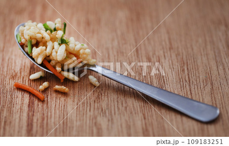 Puffed with hot spices and Bombay mix 109183251