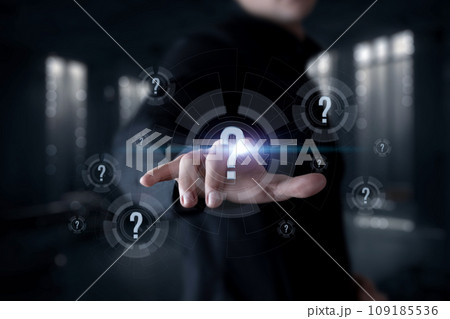 A businessman clicks on a question mark on a vertical screen. 109185536