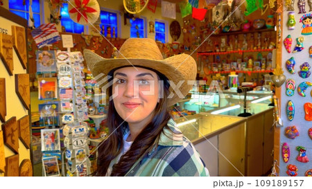 Trying on Cowboy hats in a western store in Boulder City 109189157
