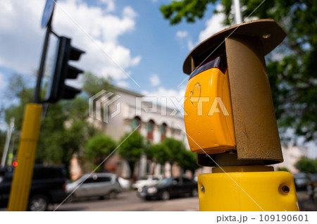 Close-up of a button for switching a pedestrian traffic light. Close-up of a button for switching a pedestrian traffic light. 109190601