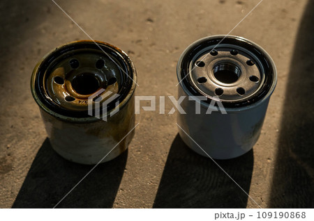 Old and new car oil filter. No people. Old and new car oil filter. No people. 109190868
