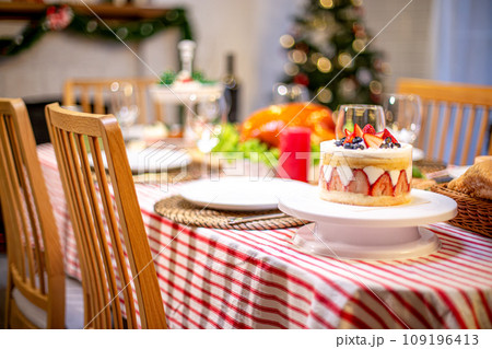 Beautiful dinner for new year and christmas tree decoration background. Beautiful dinner for new year and christmas tree decoration background. 109196413