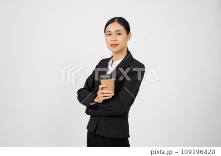 Young professional Asian businesswoman holding coffee cup and standing with white isolate background. Young professional Asian businesswoman holding coffee cup and standing with white isolate background. 109196828