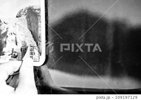 Affixing a new license registration sticker on a vehicle plate. Affixing a new license registration sticker on a vehicle plate. 109197129