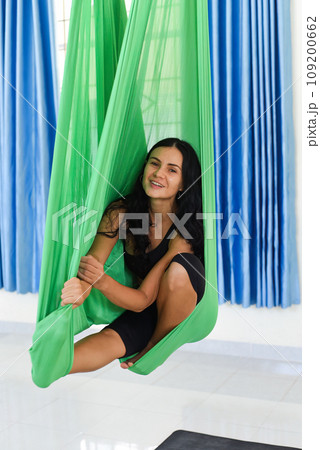Young woman making aerial or fly yoga pose Young woman making aerial or fly yoga pose 109200662