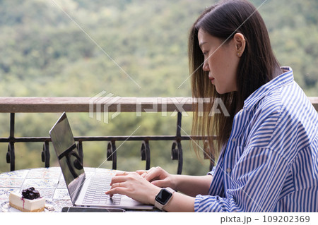 digital nomad concept asian freelancer woman use laptop to work at mountain view of coffeeshop digital nomad concept asian freelancer woman use laptop to work at mountain view of coffeeshop 109202369