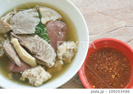 boiled pork blood and entrails with chop pork in soup on bowl dipping chili sauce boiled pork blood and entrails with chop pork in soup on bowl dipping chili sauce 109203486