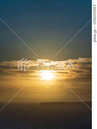 Majestic Lighthouse Silhouette Against a Stunning Sunset Majestic Lighthouse Silhouette Against a Stunning Sunset 109203967