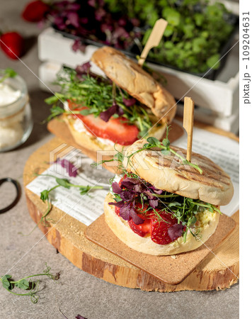 Vegan burgers with microgreens, berries and tofu. Close-up, selective focus. 109204631