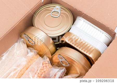 Carton Box with Canned Food, Cereals and Grocery - Donation Box or Food Reserves 109206318