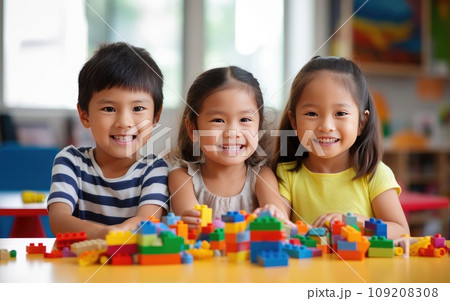 Three Children Building an Imaginative Lego Creation on a Colorful Table 109208308