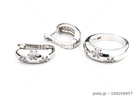 Silver jewels collection with crystals in minimalism style. Silver set of earrings and silver necklace Silver jewels collection with crystals in minimalism style. Silver set of earrings and silver necklace 109208957