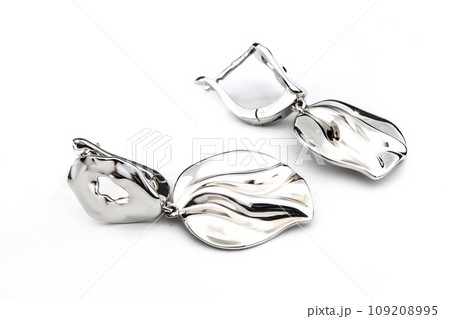 Luxury silver round earrings big jewelry for women isolated on white background, clipping path included Luxury silver round earrings big jewelry for women isolated on white background, clipping path included 109208995