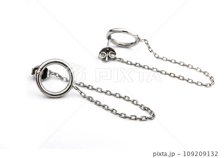 Luxury silver round earrings big jewelry for women isolated on white background, clipping path included Luxury silver round earrings big jewelry for women isolated on white background, clipping path included 109209132