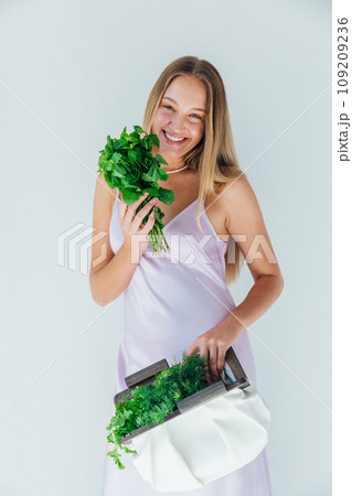 Female nutritionist holding bag with vegetables for eating 109209236
