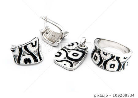 Silver jewels collection with crystals in minimalism style. Silver set of earrings and silver necklace Silver jewels collection with crystals in minimalism style. Silver set of earrings and silver necklace 109209534