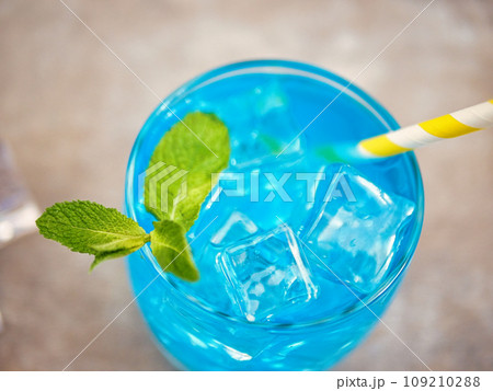 blue lemonade in a glass with ice blue lemonade in a glass with ice 109210288