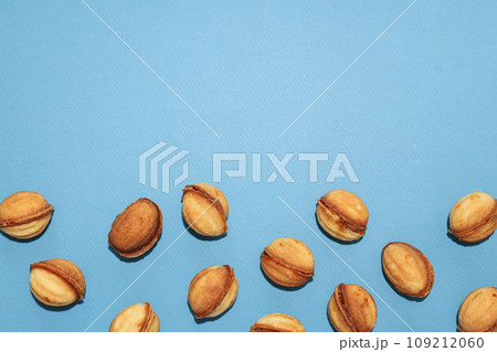 Cookies in the form of nuts on a blue background 109212060