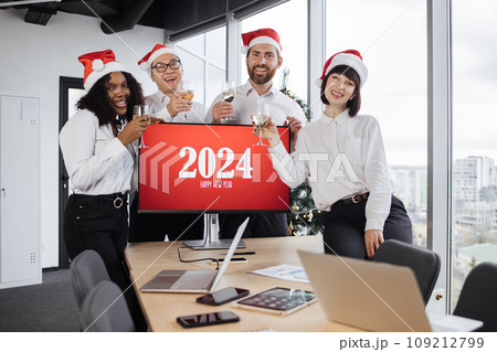 Happy successful diverse team in Santa hats of male and female workers 109212799