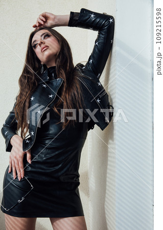 Beautiful woman posing in bright studio Beautiful woman posing in bright studio 109215598