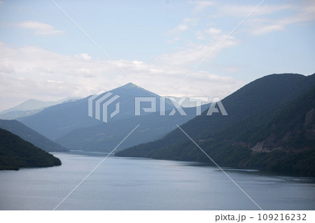 Blue lake with mountains in the background. Mountain landscape. Blue lake with mountains in the background. Mountain landscape. 109216232