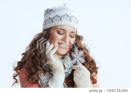 happy trendy woman in sweater, mittens, hat and scarf 109216260