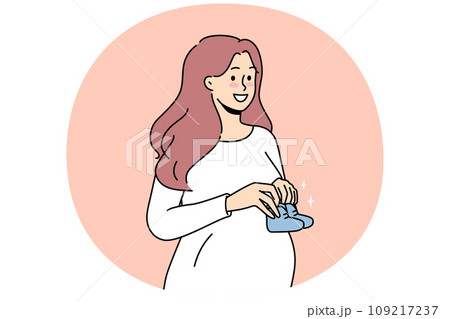 Smiling pregnant woman with baby shoes Smiling pregnant woman with baby shoes 109217237