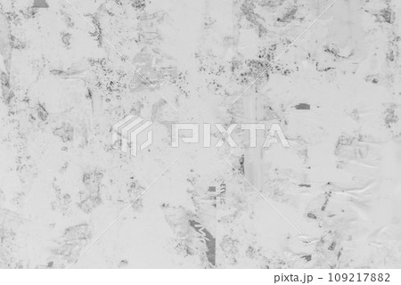 Old black and white dirty tattered paper bulletin board surface texture background Old black and white dirty tattered paper bulletin board surface texture background 109217882