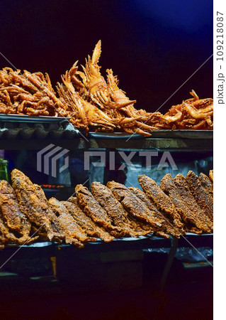 Street food and cuisine made with different types of Ocean fishes, crabs, octopus etc. at  the sea beach side of Puri seashore , Odisha, India, Asia 12.02.2020. 109218087