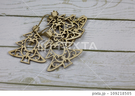 Set of wooden small Christmas trees tied together for decoration for the New Year Set of wooden small Christmas trees tied together for decoration for the New Year 109218505
