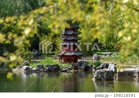 Japanese garden with pagoda and pond in summer. Japanese garden with pagoda and pond in summer. 109218591