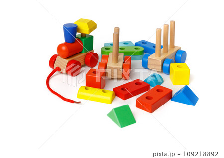 A set of Montessori children's educational toys made from different blocks and puzzles isolated on white background A set of Montessori children's educational toys made from different blocks and puzzles isolated on white background 109218892