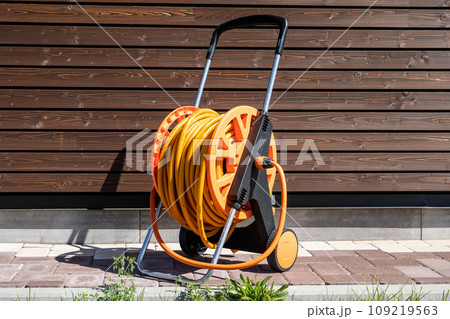 Garden hose for watering plants and flowers. Gardening equipment 109219563