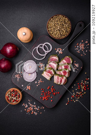 Delicious fresh bacon stripes with spices and salt Delicious fresh bacon stripes with spices and salt 109219927