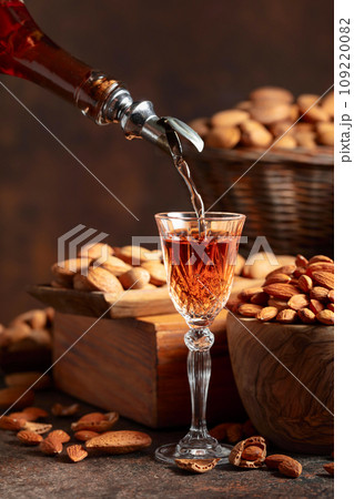 Italian liqueur Amaretto with almonds nuts. Italian liqueur Amaretto with almonds nuts. 109220082