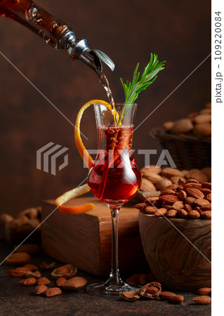 Italian liqueur Amaretto with almonds nuts. 109220084