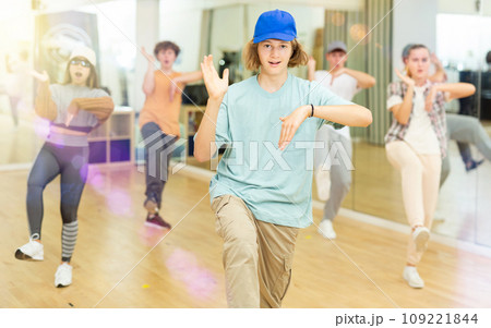Youth boys and girls dancing hip-hop in ballroom Youth boys and girls dancing hip-hop in ballroom 109221844