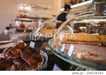 Assorted pastries on display in a bakery. Freshly baked goods on a counter. Sweet treats for sale in a local shop. 109226163