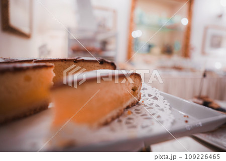 Delicious slice of cake on a white plate in a Venetian restaurant. Simple presentation with no specific decoration. Part of a collection showcasing summer in Venice, Italy. 109226465