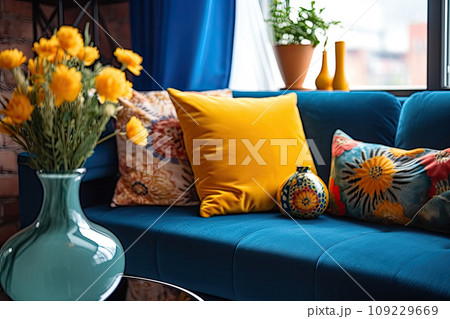 Colorful pillows on a sofa with little vase Colorful pillows on a sofa with little vase 109229669