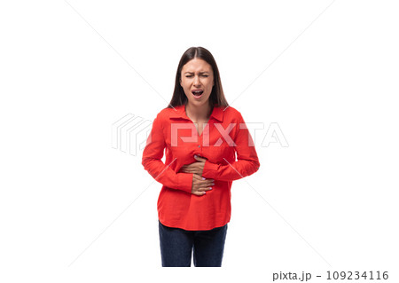 young brunette secretary woman dressed in a red shirt holding her stomach in pain on a white 109234116