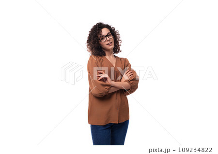 young cute caucasian curly brunette woman dressed in a beautiful brown shirt young cute caucasian curly brunette woman dressed in a beautiful brown shirt 109234822