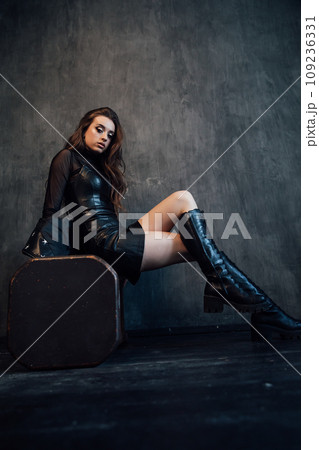Portrait of a beautiful fashionable daring woman in dark clothes 109236331